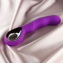Edonista Colt G-spot Vibrator Purple displayed on satin fabric, featuring a ribbed silicone design for enhanced pleasure.