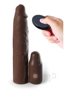 Fantasy X-Tensions Elite Vibrating 9 Inch Sleeve Chocolate with removable vibrating extender in hand.