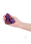 Inya Alpine Silicone Anal Plug with Remote Control Purple held in a hand, showcasing its design and size.