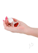 Crystal Desires Red Heart Glass Anal Plugs Small held in hand showcasing its design and heart accent.