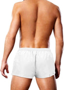 Back view of a man wearing Prowler Oversized Paw Swimming Trunk White XL for summer swimming and beach activities.