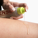 Sense Water Based Lubricant 90 ml being applied to skin, showcasing its smooth texture and easy dispensing.