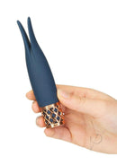 Pillow Talk Secrets Playful Silicone Massager Blue/Rose Gold shown in hand, featuring elegant design and flexible tips.