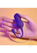 Playboy Double Time Silicone Vibrating Kegel Balls Purple held in a hand, showcasing its unique design and purple color.