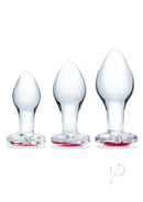 Glas Heart Jewel Glass Anal Training Set 3 Piece Clear featuring three crystal-clear plugs with red jewel bases.