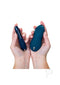 We-Vibe Forever Favorites Set held in hands, featuring Tango X bullet vibrator and Touch X massager in blue and green.