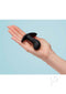 Black FUN FACTORY Bootie Small butt plug held in hand, ideal for beginners and anal play enthusiasts, featuring a soft, flexible design.