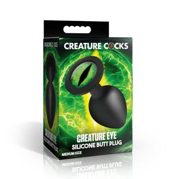 Creature Cocks Green Eye Silicone Butt Plug Medium packaging featuring green eye design and bold visuals.