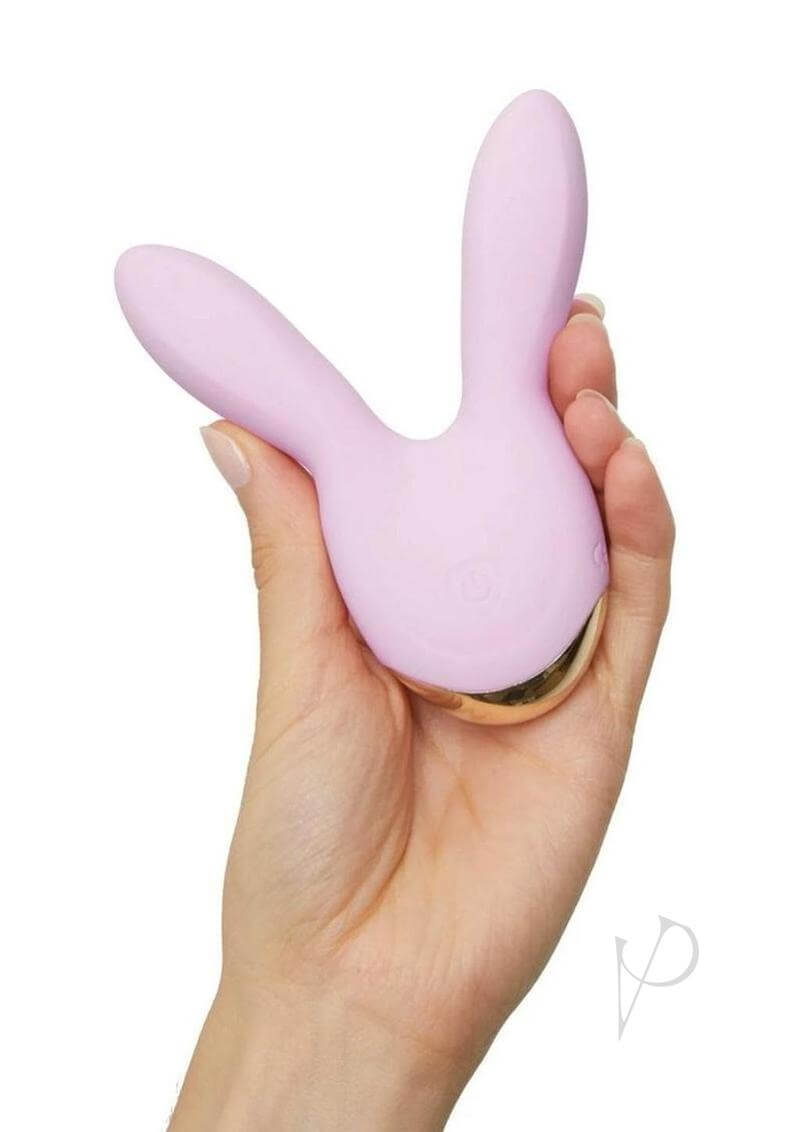Hear Me Baby Rechargeable Clitoral Stimulator Baby Pink in a hand, showcasing its playful design and soft flexible ears.
