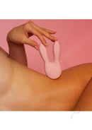 Hear Me Baby Rechargeable Clitoral Stimulator Baby Pink on skin background with playful design and soft ears.