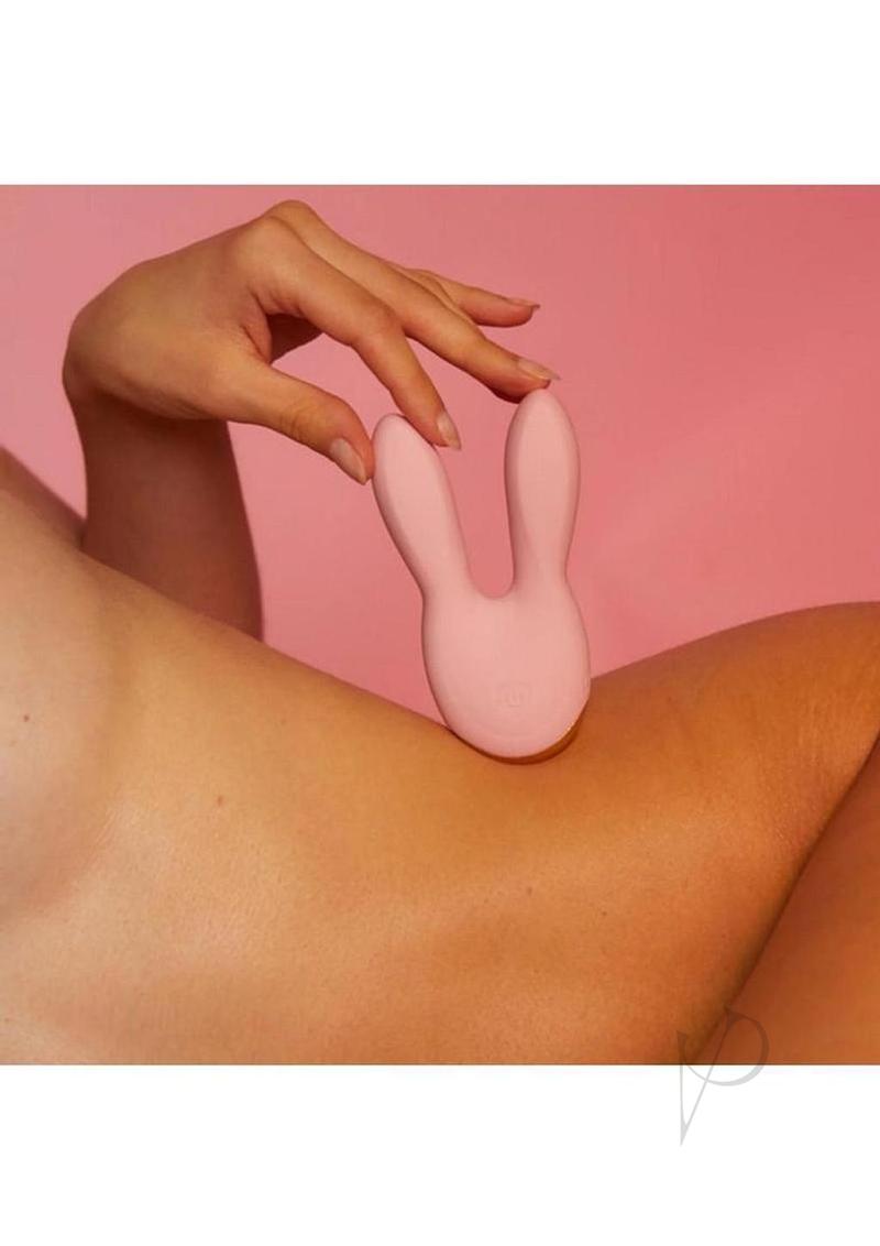 Hear Me Baby Rechargeable Clitoral Stimulator Baby Pink on skin background with playful design and soft ears.