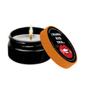 Kama Sutra Naughty Notes I Wanna Suck Massage Candle 1.7 Oz with open lid and warm light.