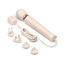 Le Wand Plug-In Vibrating Massager Cream with power adapter and interchangeable plugs in a sleek cream design.