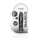 Realrock 6 Inch Penis Extender Sleeve Black in packaging showcasing its realistic design and flexibility.