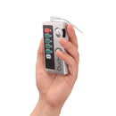 Shots Toys E-stim Urethral Sounding Set Small Silver remote control in hand, showcasing buttons for power and settings.