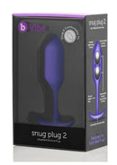 B-Vibe Snug Plug 2 Silicone Weighted Anal Plug Purple packaging showcasing design features.