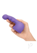 Le Wand Petite Ripple Silicone Attachment Cover Violet held in hand for blended orgasm stimulation.