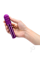 Le Wand Grand Bullet Rechargeable Silicone Vibrator Cherry held in a hand, showcasing its vibrant purple design.
