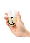 Le Wand Double Vibe Silicone Vibrator White Gold held in hand, showcasing its compact design and controls.