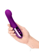 Le Wand Gee Silicone Body G-Spot Vibrator Cherry being held in hand with control buttons visible.