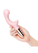 Le Wand XO Silicone Dual Stimulating Vibrator Rose Gold held in hand, showcasing its elegant design and dual motors.