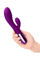 Le Wand Blend Rechargeable Silicone Rabbit Vibrator Cherry held in hand, showcasing its dual-zone stimulation features.