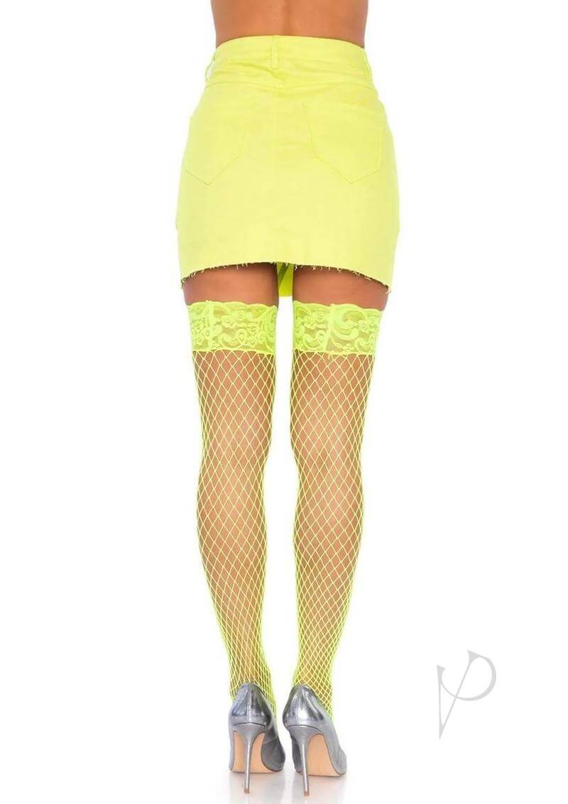 Leg Avenue Spandex Industrial Net Thigh Highs OS Neon Yellow worn with a yellow skirt, featuring a floral lace top and fishnet design.