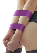 Whipsmart Bondage Tape 100 Feet Purple wrapped around wrists for versatile bondage play.