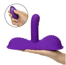 Triple Rider Remote Control Gyrating Rumbler Vibrator in hand showcasing its textured silicone design.