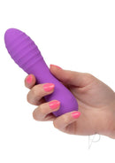Hand holding the Bliss Liquid Silicone Ripple Rechargeable Vibrator Purple highlighting its ergonomic design.