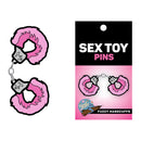 Wood Rocket Fuzzy Handcuffs Soft Enamel Lapel Pin featuring pink fuzzy handcuffs on a card with text 'SEX TOY PINS'.