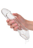 Performance Maxx 7.5 Inch Penis Extension Clear held in hand, showcasing its transparent design and lifelike construction.