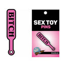 Wood Rocket Sex Toy Pin Bitch Paddle Hot Pink featuring a cheeky paddle design with the word BITCH on a pink background.