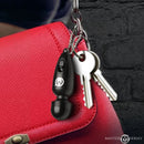 Master Series Thunderstick Mini Vibrating Wand Keychain attached to a red bag with keys.