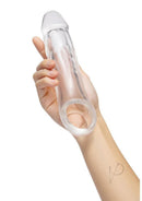 Size Up 2 Inch Girthy Clear View Penis Extender held in hand, showcasing its transparent design and realistic details.