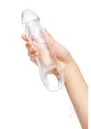 Size Up 3 Inch Extra Girthy Clear View Penis Extender held in hand, showcasing its realistic shape and transparent design.