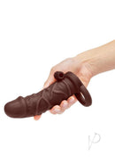 Size Up 1 Inch Vibrating Silicone Penis Extender Chocolate being held, showcasing its realistic texture and design.