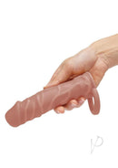 Size Up 1 Inch Penis Extender with Ball Loop Caramel held in hand, showcasing realistic design and comfortable fit.