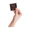 LELO HEX Respect XL Lubricated Latex Condoms 12 Pack in hand, showcasing the elegant packaging.