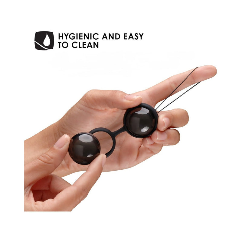Close-up of a hand holding LELO BEADS Noir Kegel Balls Set Black, highlighting hygienic design and easy cleaning.