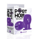 The 9's Port Hole Hollow Butt Plug Purple packaging showcasing a large peeker plug design in body-safe material.