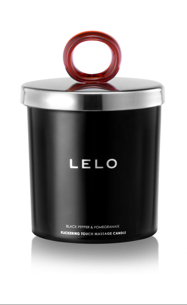 LELO Massage Candle Black Pepper Pomegranate Scent in a chic black container with a looped red handle.