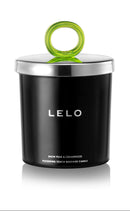 LELO Massage Candle Snow Pear and Cedarwood Scent in a sleek black container with a green lid.