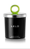 LELO Massage Candle Snow Pear and Cedarwood Scent in a sleek black container with a green lid.