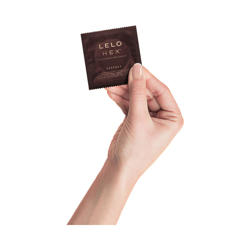 LELO HEX Respect XL Lubricated Latex Condoms 36 Pack in a hand holding the condom package.