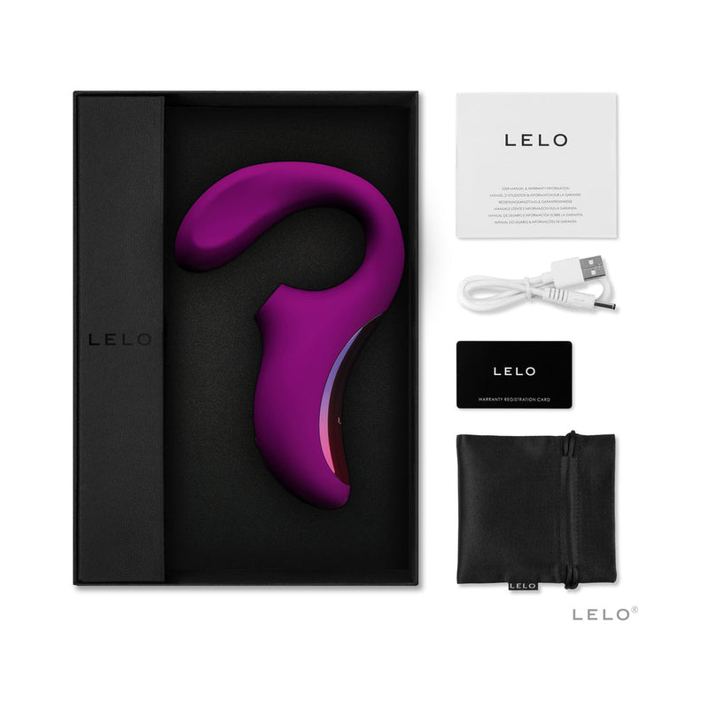 LELO ENIGMA Suction Dual Stimulator Deep Rose in packaging with accessories including charging cable and care card.