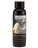 Earthly Body Edible Massage Oil 2 oz Banana in a sleek bottle featuring a banana and a smiling face.