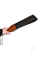 Prowler RED Leather and Wood Flapper Paddle held in hand, showcasing its elegant design and impact play features.
