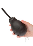 Water Systems One-Way Anal Douche Black held in hand, featuring a slender black nozzle for comfortable use.