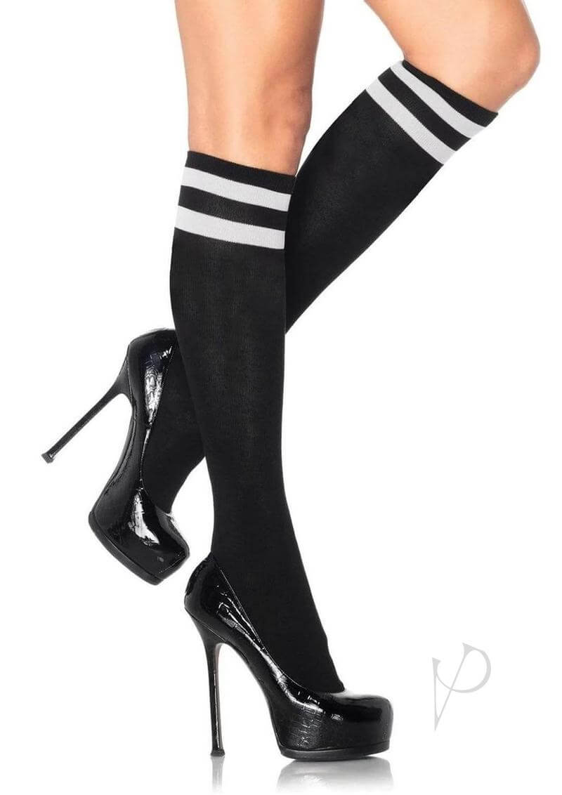 Leg Avenue Athletic Knee High OS Black worn with high heels, showcasing sporty style and iconic stripes.